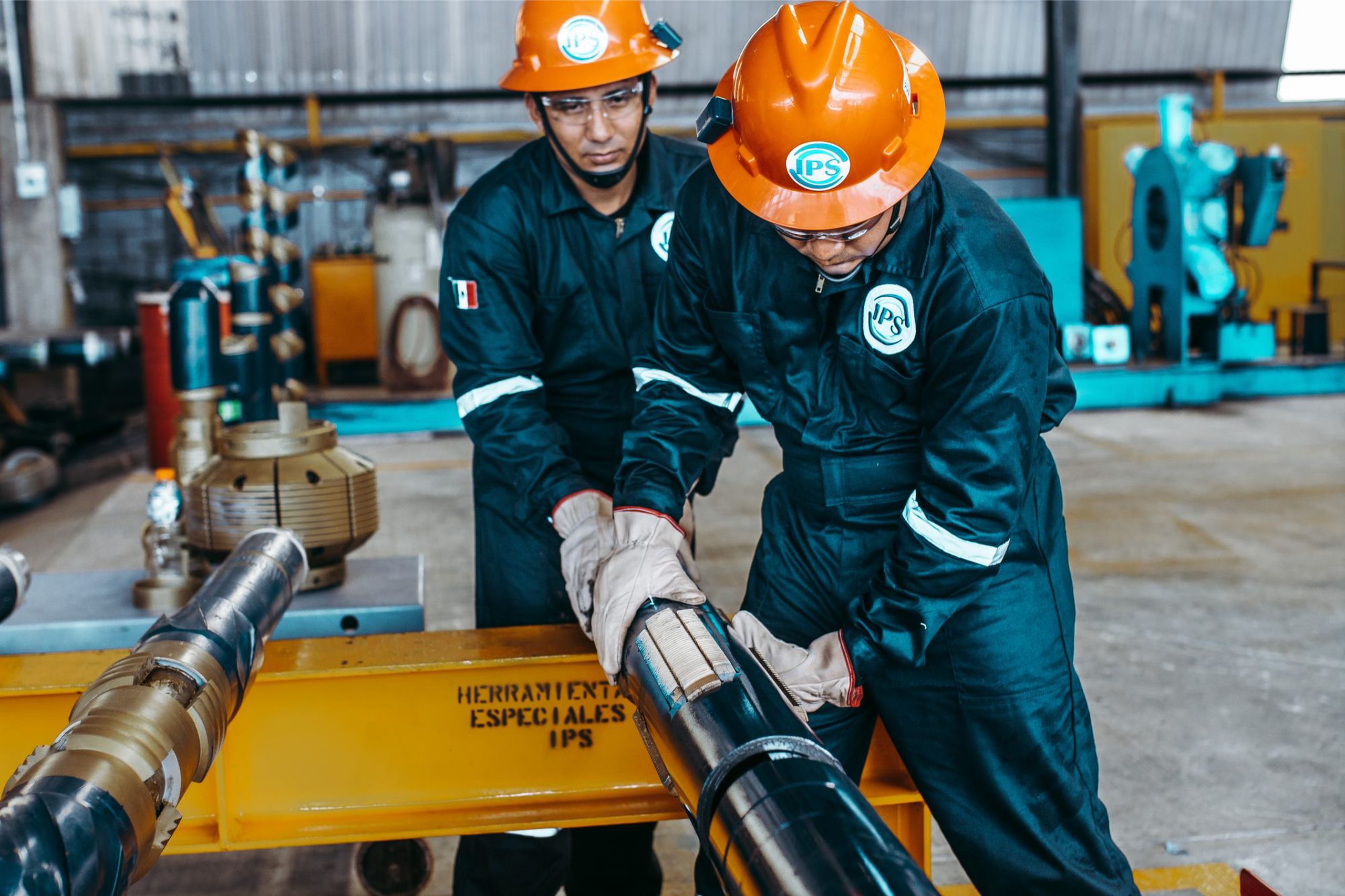 Technicians preparing a liner hanger assembly