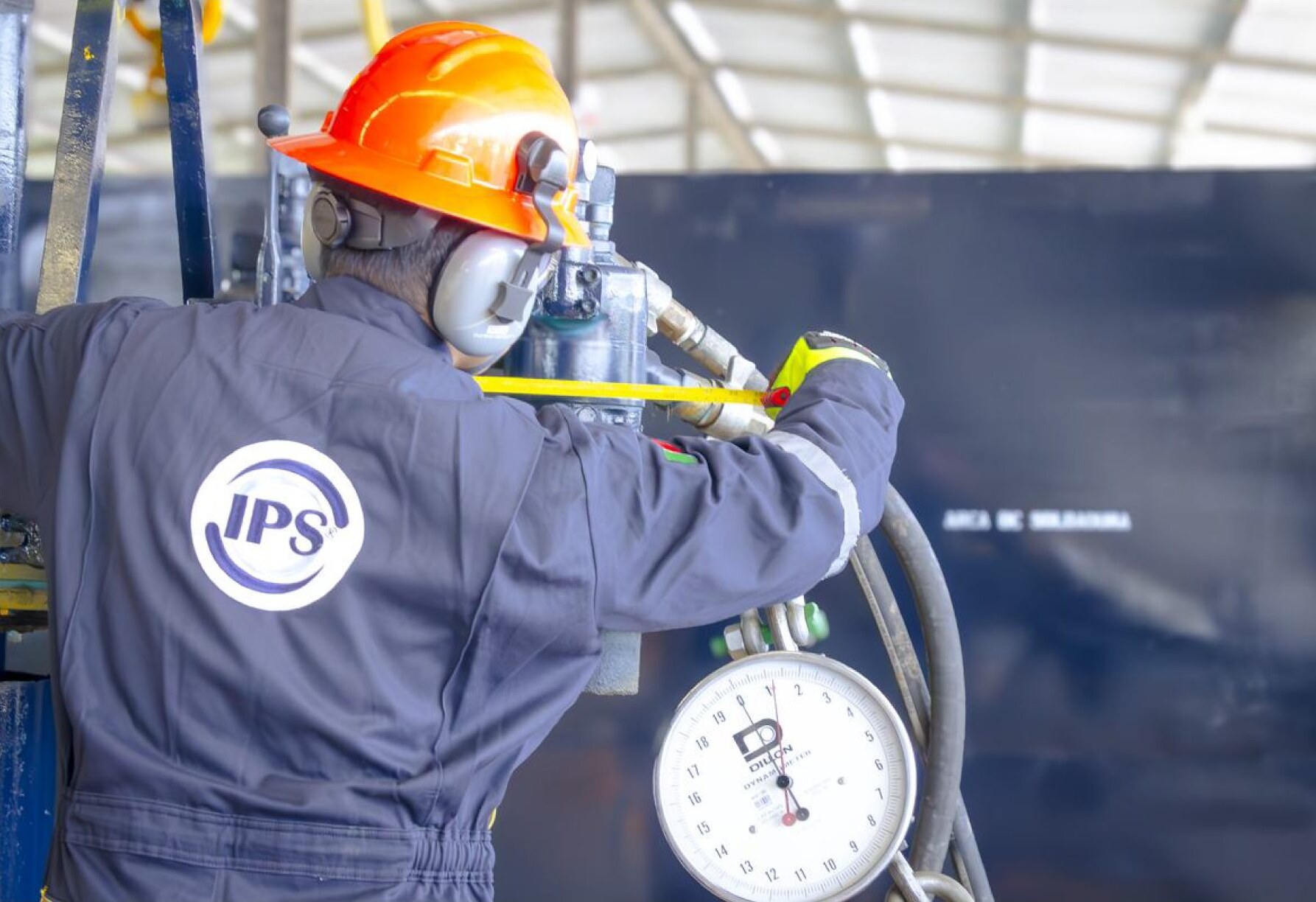 Technician reading a torque gauge