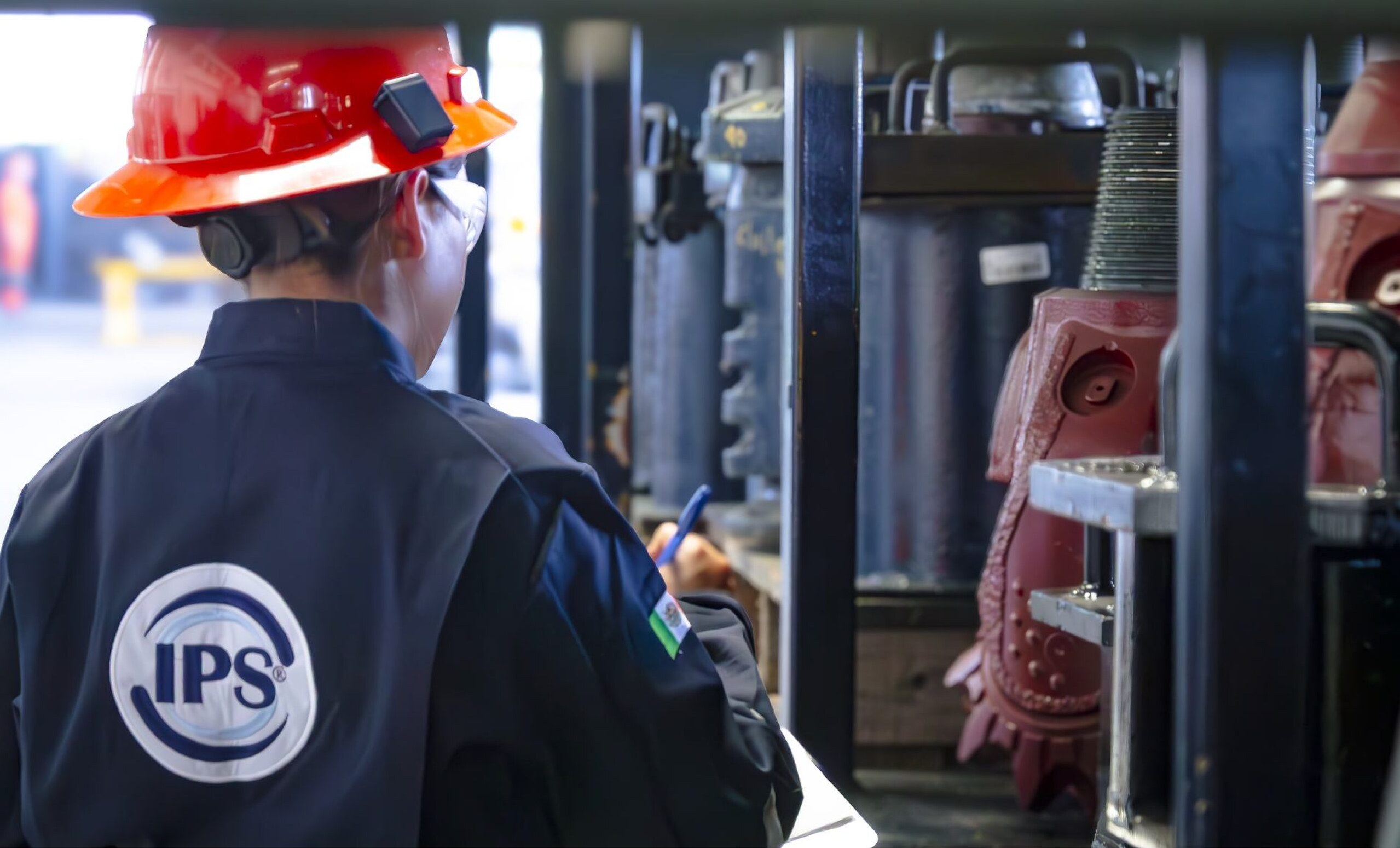 Technician inspecting tricone bits on the shop floor