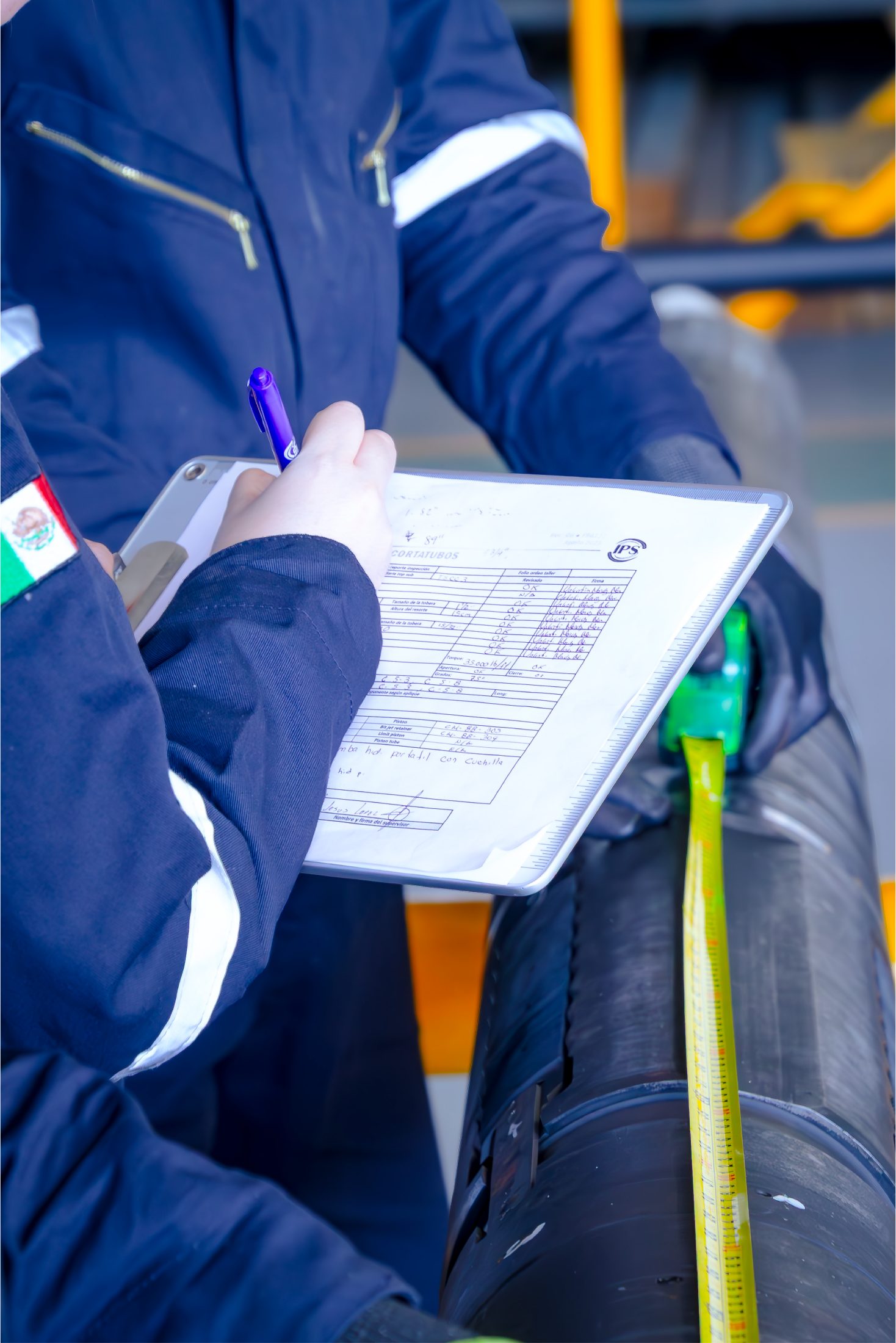 Inspector filling in an inspection report on a clipboard