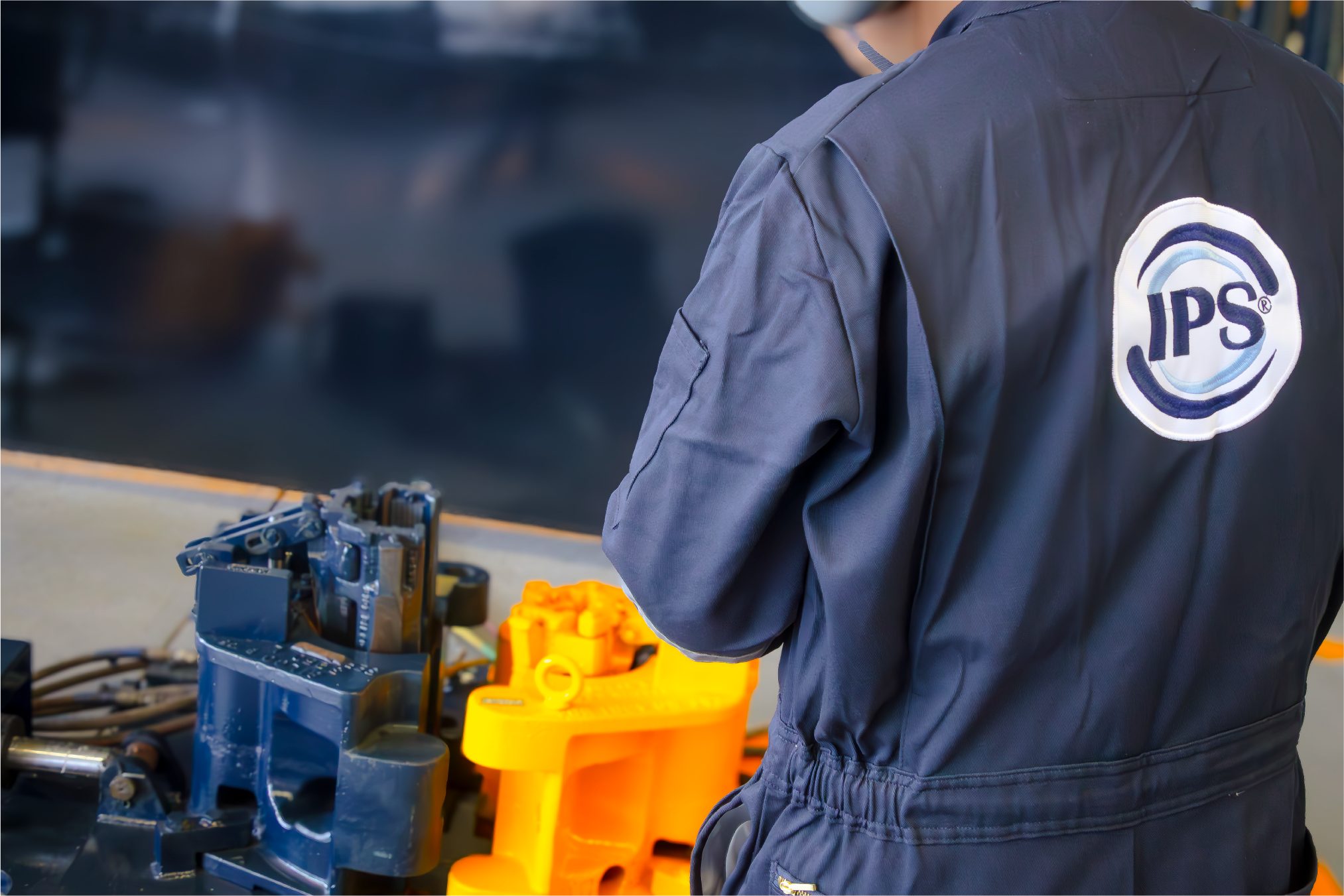 Technician working at a machine shop bench