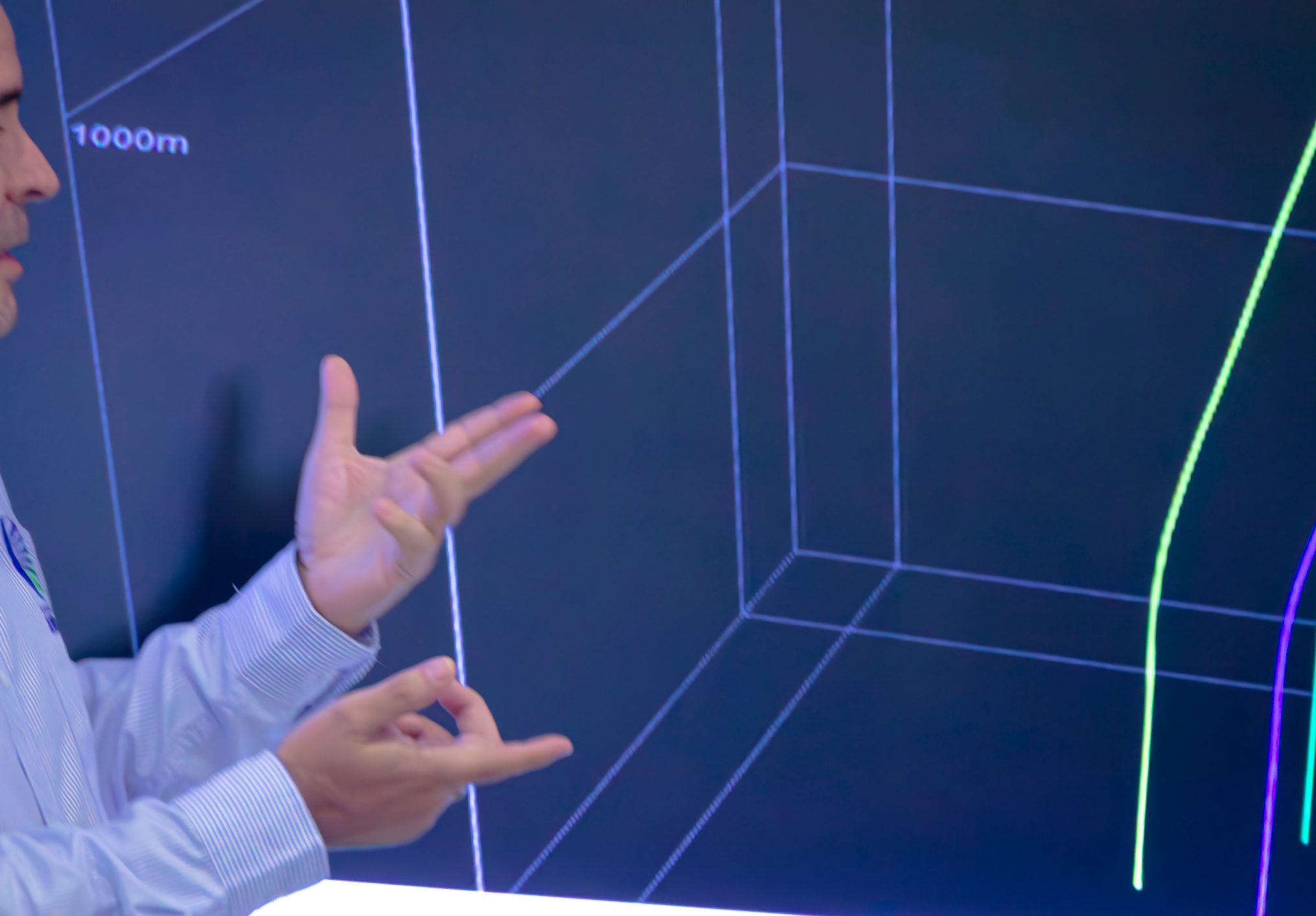 Engineer explaining a three-dimensional subsurface model on a screen