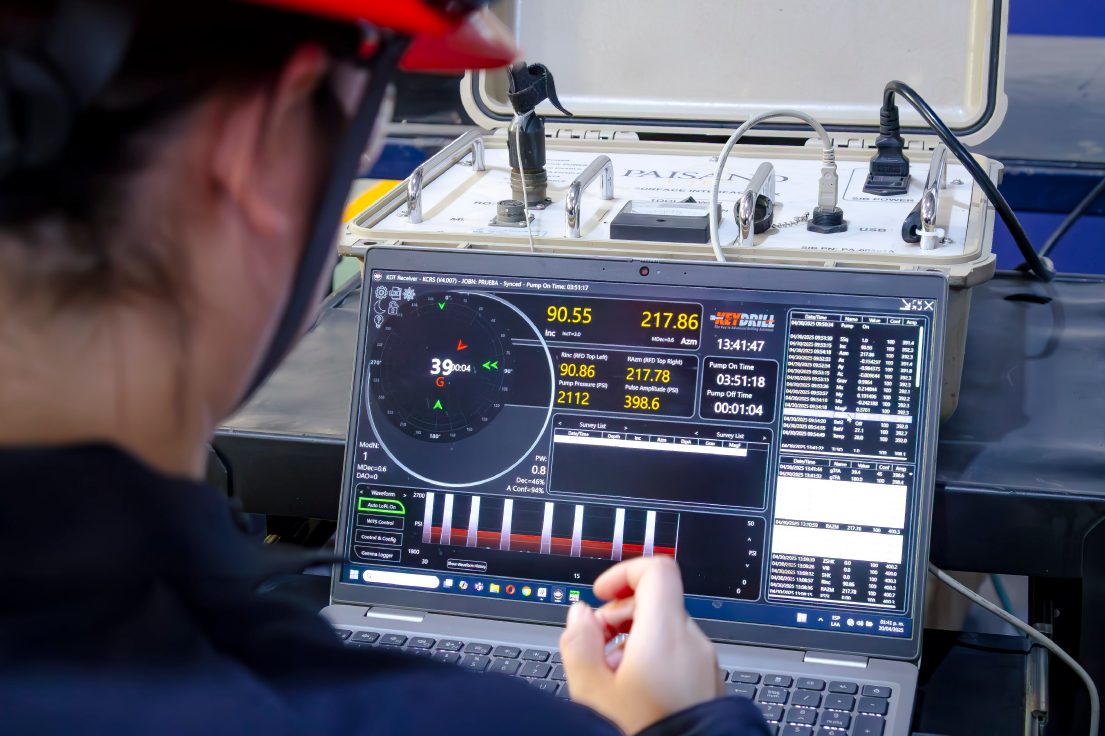 Technician monitoring well test equipment