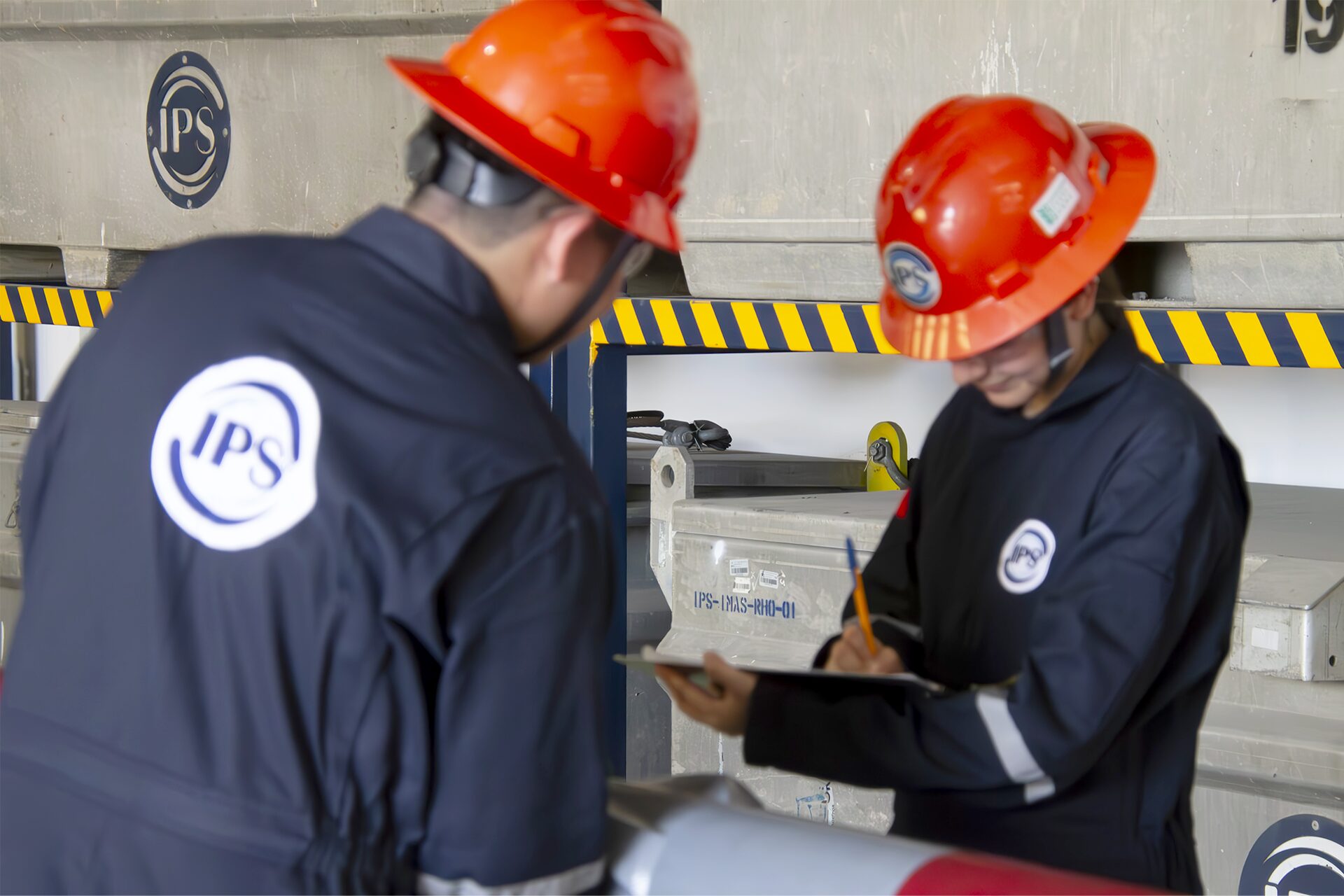 Technicians inspecting downhole motors in the workshop