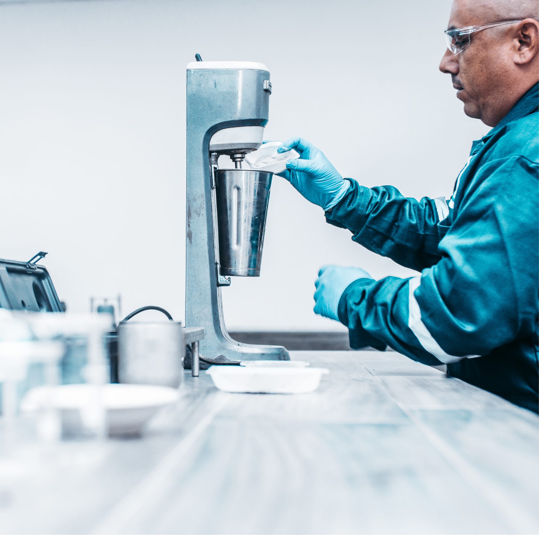 Laboratory technician operating a mixer