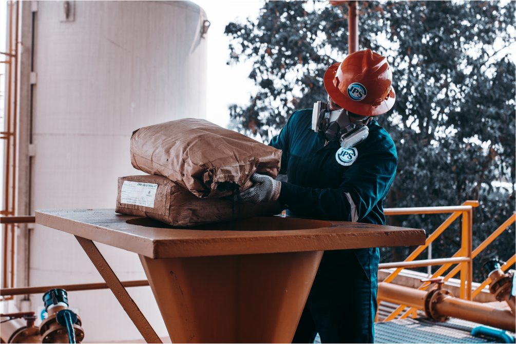 Technician loading stimulation product into a hopper